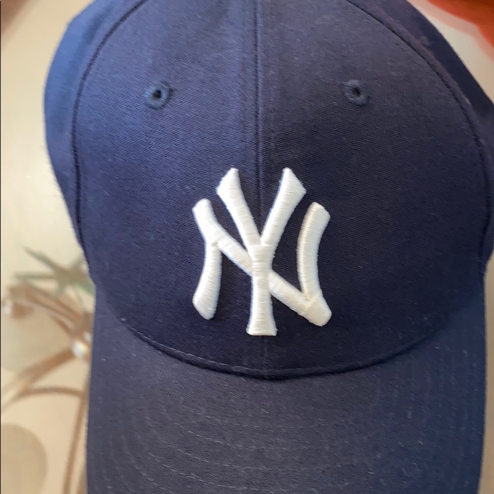 By Yankees hat
